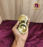 Brass Shell Shape KumKum Box 1 Inch open hand view